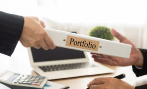 A portfolio being handed to someone